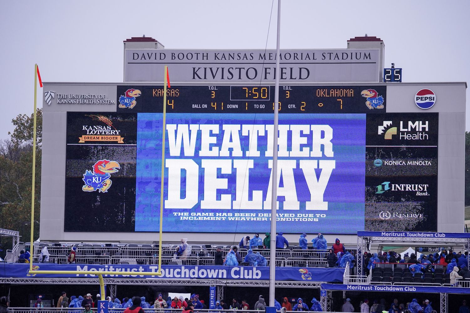 Oct 28, 2023; Lawrence, Kansas, USA; A general view of the scoreboard showing the current weather delay during the first half of the game between the Kansas Jayhawks and Oklahoma Sooners at David Booth Kansas Memorial Stadium. Mandatory Credit: Denny Medley-USA TODAY Sports  